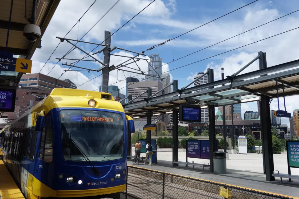 Blue and yellow light rail train at station in Minneapolis, Minnesota